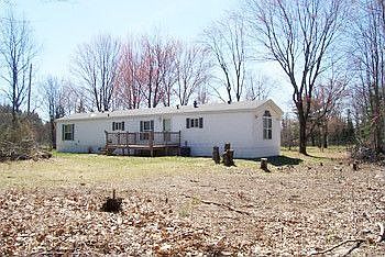 Perfect Getaway or Year Round Home... Newer 3 bedroom 2 bath mobile home with central air, natural gas furnace & gas log stove.  Property fronts on paved road.  Not far from here to the river, State land and lots of fun times! Please call or e-mail for information sheet, map, aerial view & more picturs.