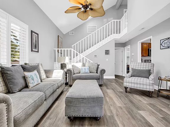 Walk into living room, with kitchen on the left and master bedroom / bath on main level.