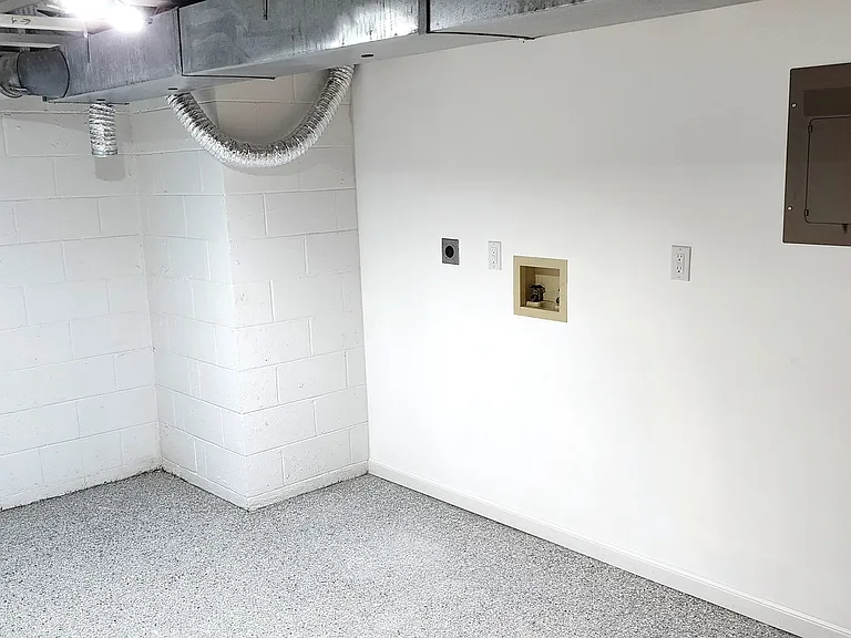 Laundry Room with Polyaspartic Floors Machines Available