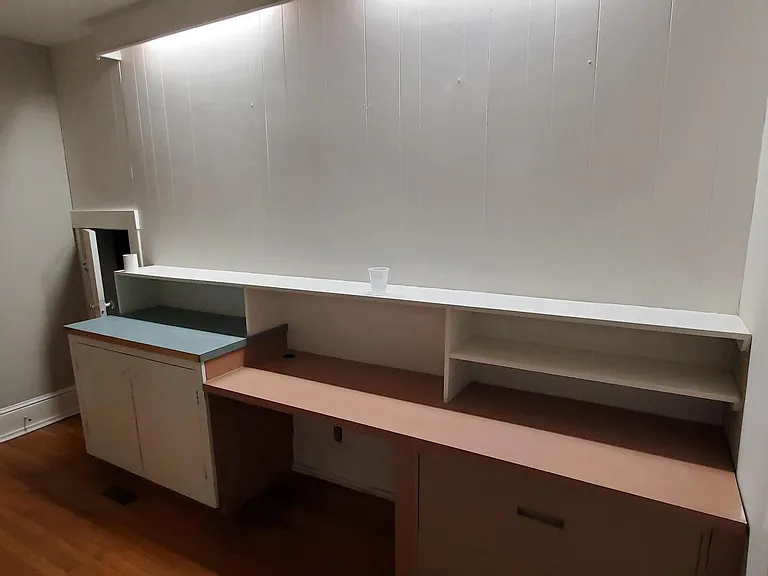 Foyer when you walk in front door to unit with built in desk unit and storage