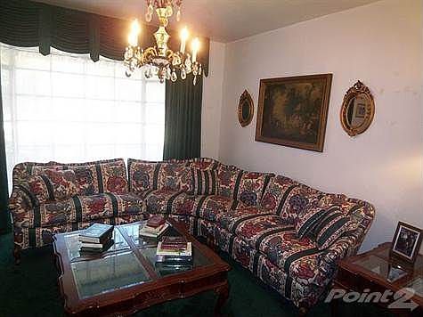 Off the entry is the living room.