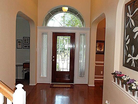 Two story entry with leaded glass front door.