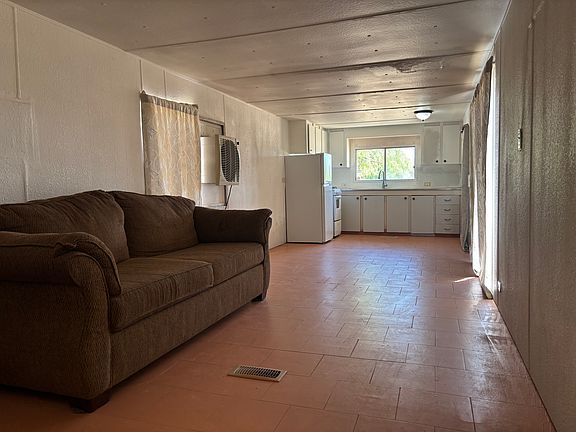 view towards kitchen from the far end of the living room