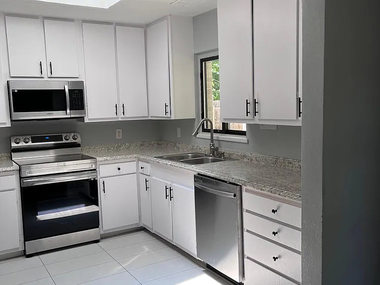 brand new kitchen appliances and tile floor! very bright room with natural light from skylight!