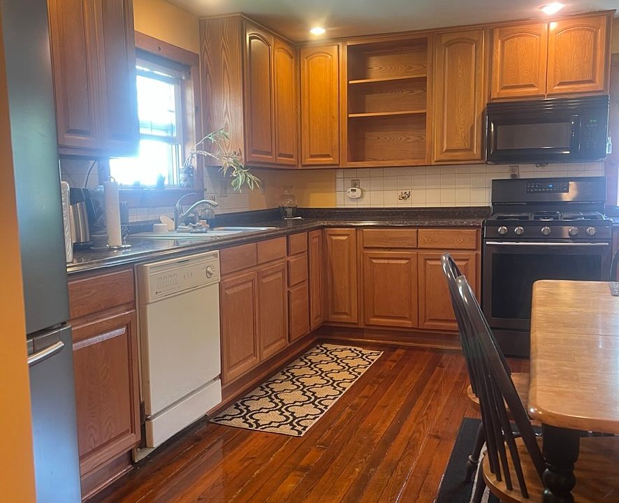 Kitchen showing dishwasher, Samsung gas stove, microwave, three-door refrigerator and freezer