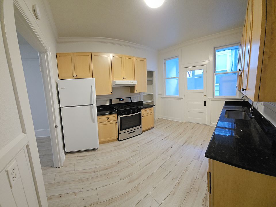 kitchen panorama looking onto laundry porch