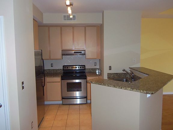 The kitchen features granite counters, subway tile backsplash and more.