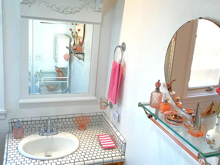 Gorgeous Beveled Vanity Mirror w/French Bow Cartouche crowned by a shelf of Vintage Pink DG