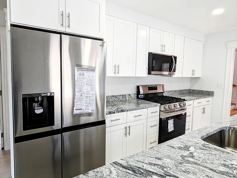 New Fridge with water and ice dispenser, New stove and lots of cabinet space. Even more cabinets in the island with dishwasher.