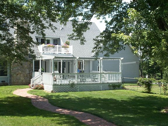 Back of home with deck