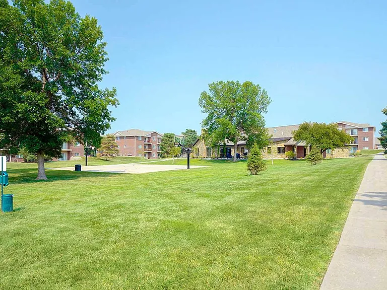 Open green space, mature trees, and a basketball half court invite you to stretch out, play, or simply enjoy the fresh air.