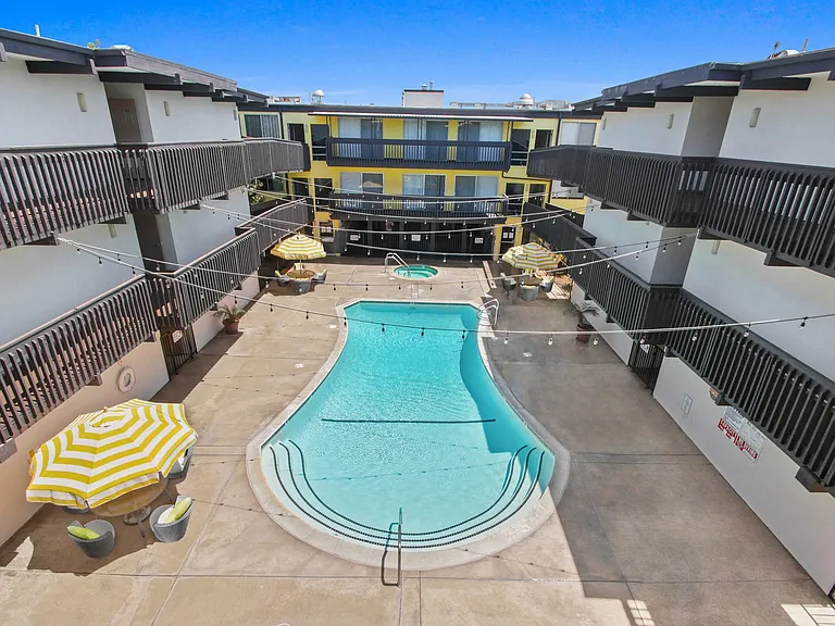 Resort-style swimming pool with lounge just steps from your front door