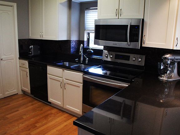 Black granite counter tops, stainless appliances