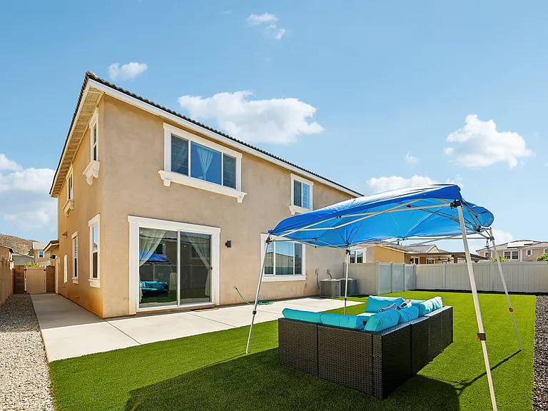 Enjoy the outdoors in our backyard, complete with comfortable outdoor furniture.