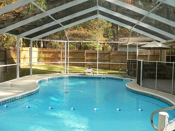 Screened in heated pool with Baby fence protection