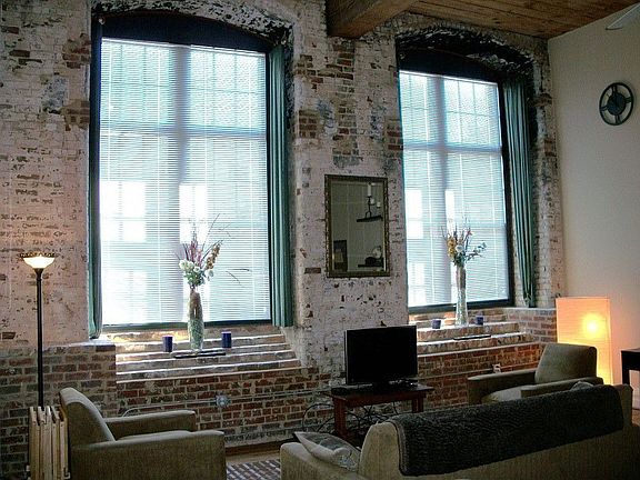 Large living room area for watching TV with a dozen of your closest friends. Open to dining area and