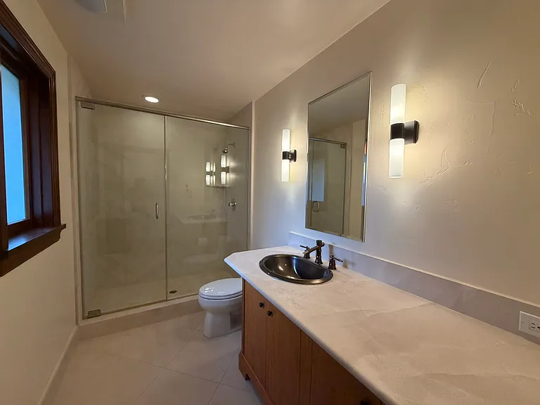Main floor full bath, located next to the bedroom/office and across the hall from the main bedroom.