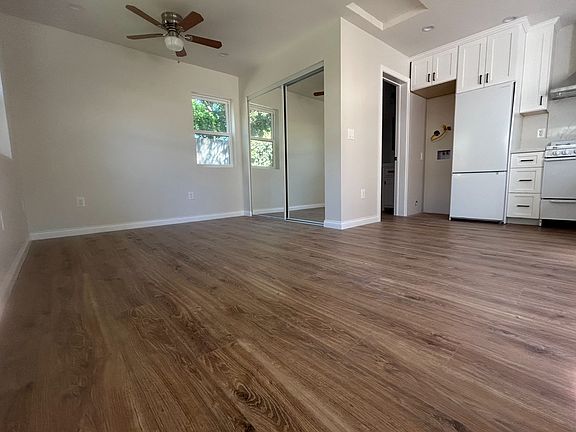 The open-concept studio maximizes space and features waterproof laminate flooring.