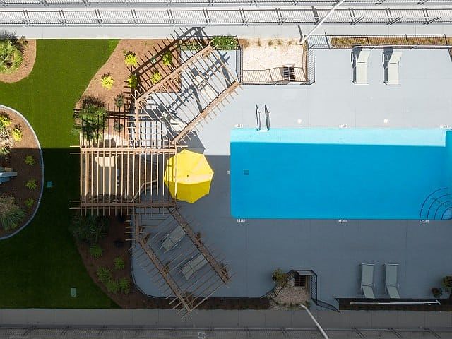 Relax in the Shade by the Pool with Sundeck Pergolas at Legacy Student Living