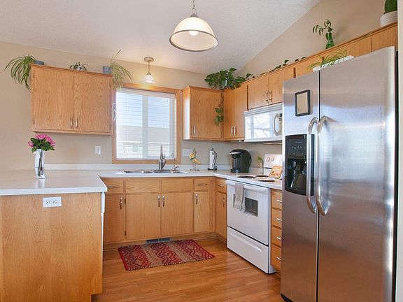 Kitchen. Refrigerator replaced with a white one.