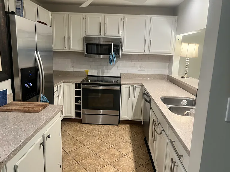 Kitchen is on large scale for apartments.