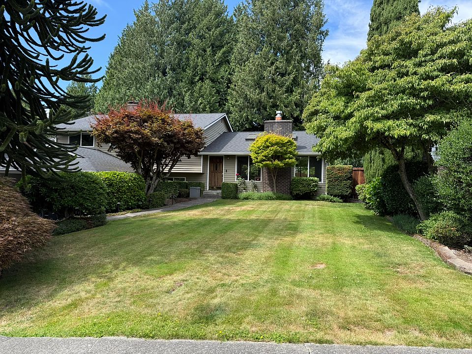 Front View of the House - in addition to the garage and the driveway there is parking available in front of the house. Street is very wide and has paved sidewalks on both sides.