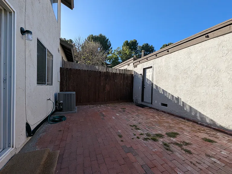 Private Patio between Condo & Garage