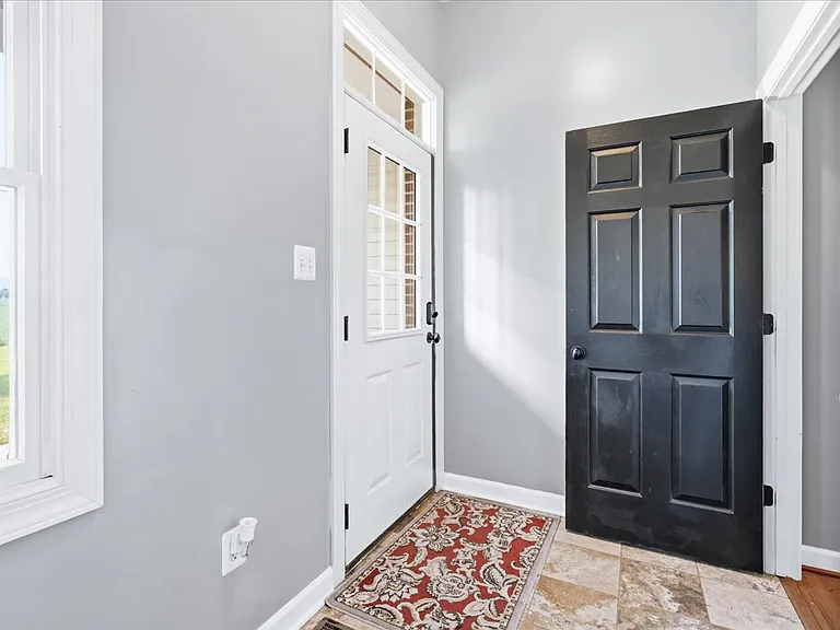 Mudroom adjacent to garage