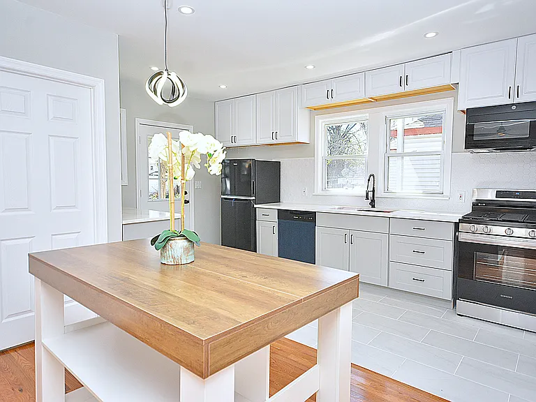 Kitchen - moveable island with wood top that seats 2.