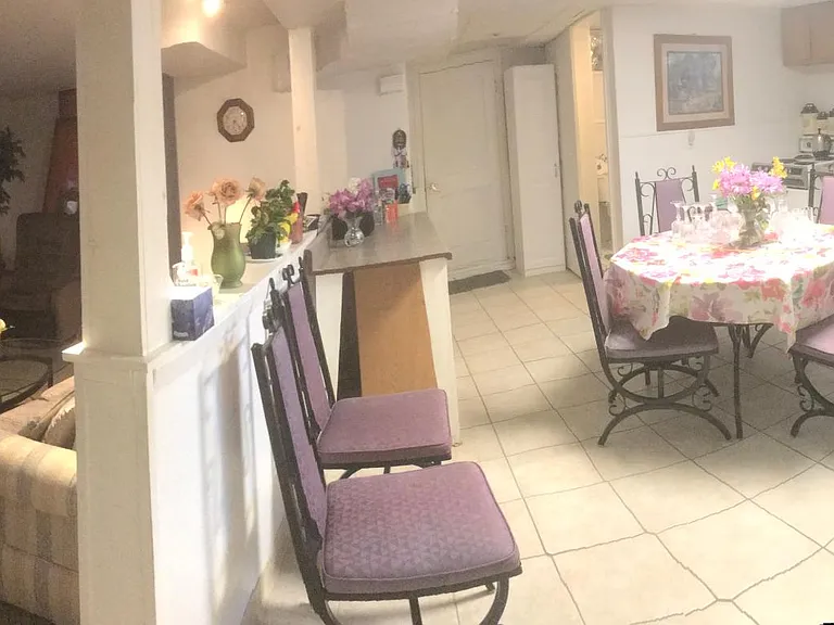 Kitchen with half wall divider, living room