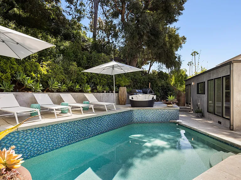 Refresh and unwind under the California sun in the tranquil oasis of the pool at the Beverly Hills Canyon Villa.