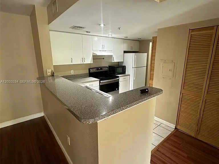 5035 Wiles Rd #203 — Photo 16