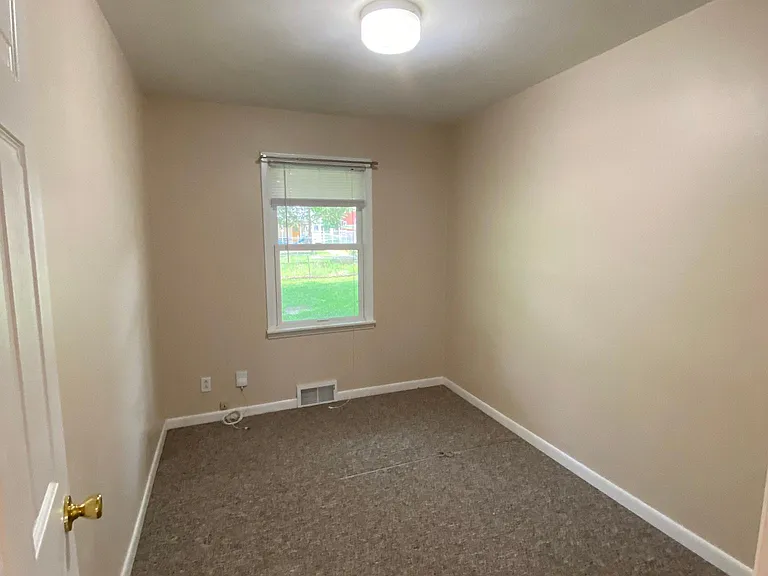 Smallest single bedroom with no closet. Can be a nursery or office space.