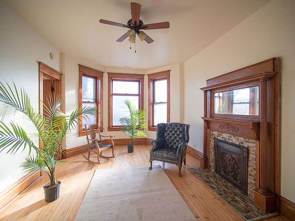 Living room with bay window, tile fireplace surround