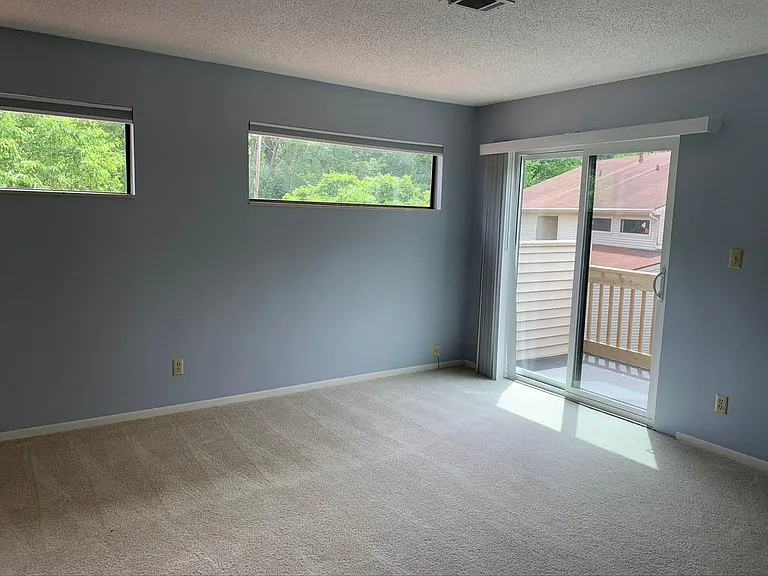 Master bedroom with it's own deck and walk in closet and bathroom