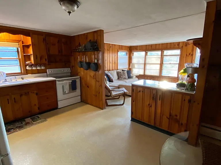 Eat-in kitchen foreground, living room in back