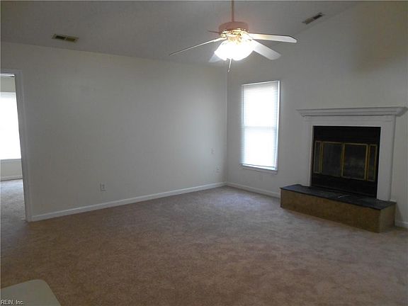 Living Area with wood-burning fireplace.