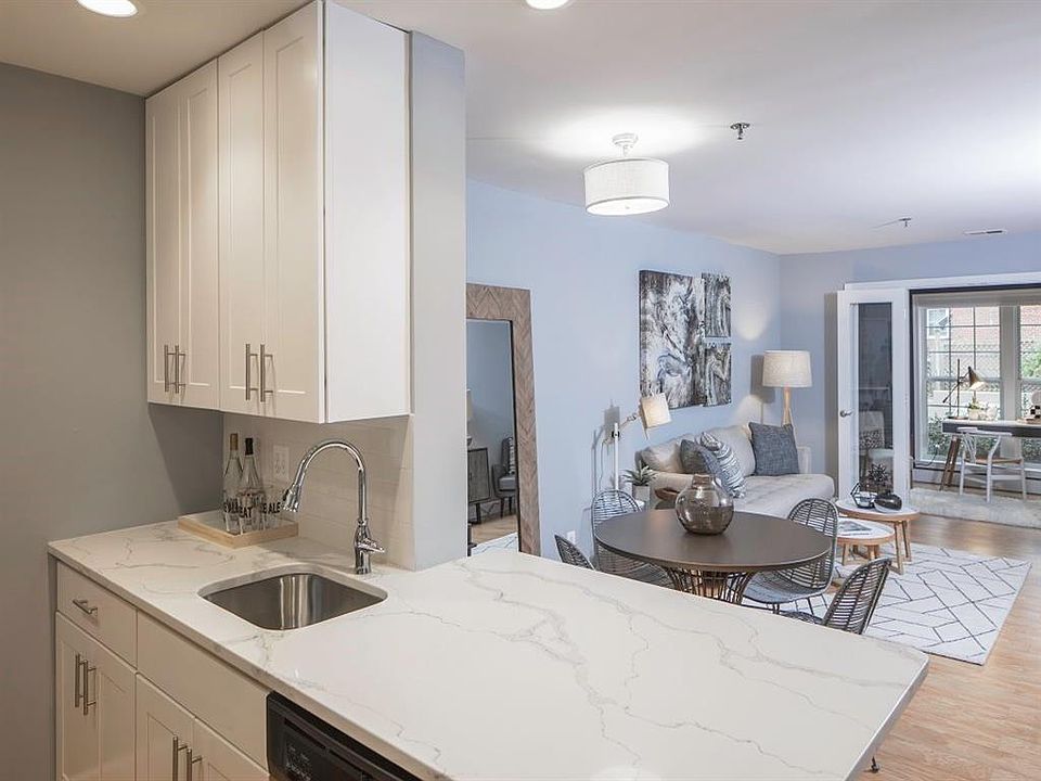 Gourmet Kitchen with Dishwasher, Garbage Disposal, Microwave, Granite Countertops, and Modern Appliances