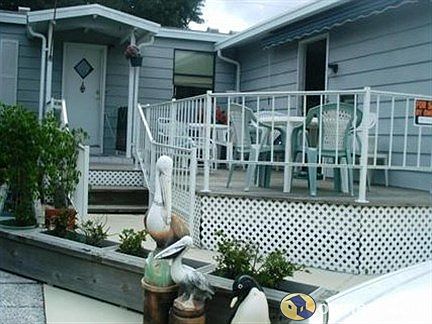 Front of house w/decking/garage