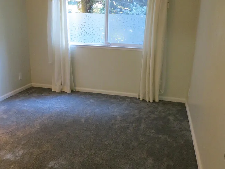 Second Bedroom, new carpet, baseboards; windows overlook sid