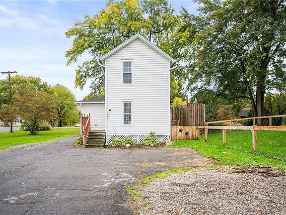 Back of the property, Huge yard and backyard. Parking area and entrance to the upper apartment.
