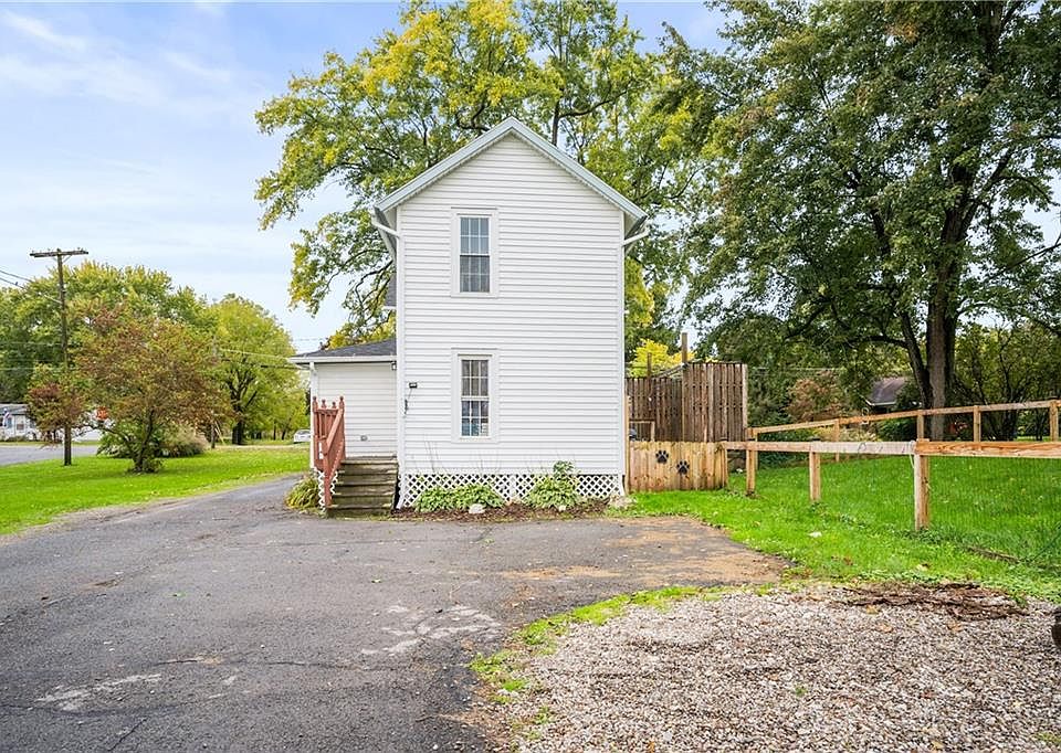 Back of the property, Huge yard and backyard. Parking area and entrance to the upper apartment.