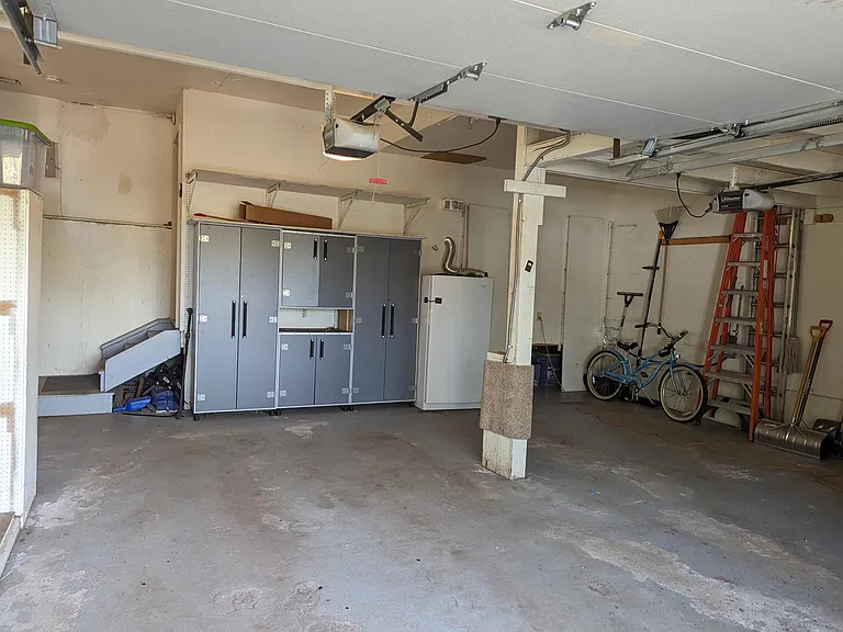 Garage with upright freezer