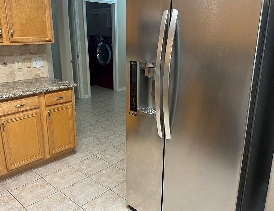 Fridge is included, as well as front load washer and dryer