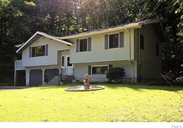Low Maintenance One Acre Lot in Great Neighborhood and Close to All Town Services.