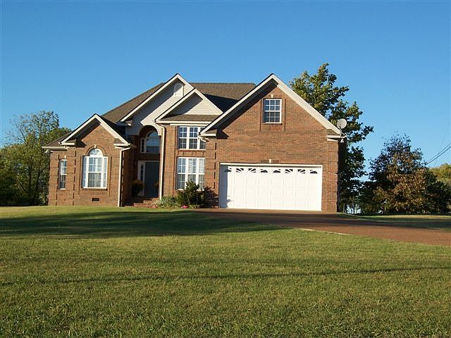 Custom brick beauty on 1.02 acres