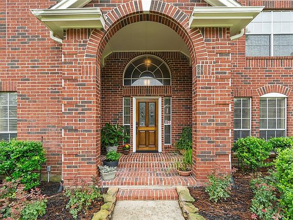 Welcome home! Very elegant and inviting large covered brick patio.