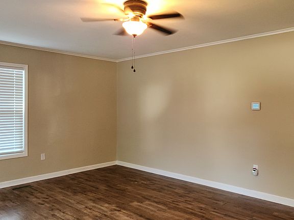 Living room with ceiling fan.