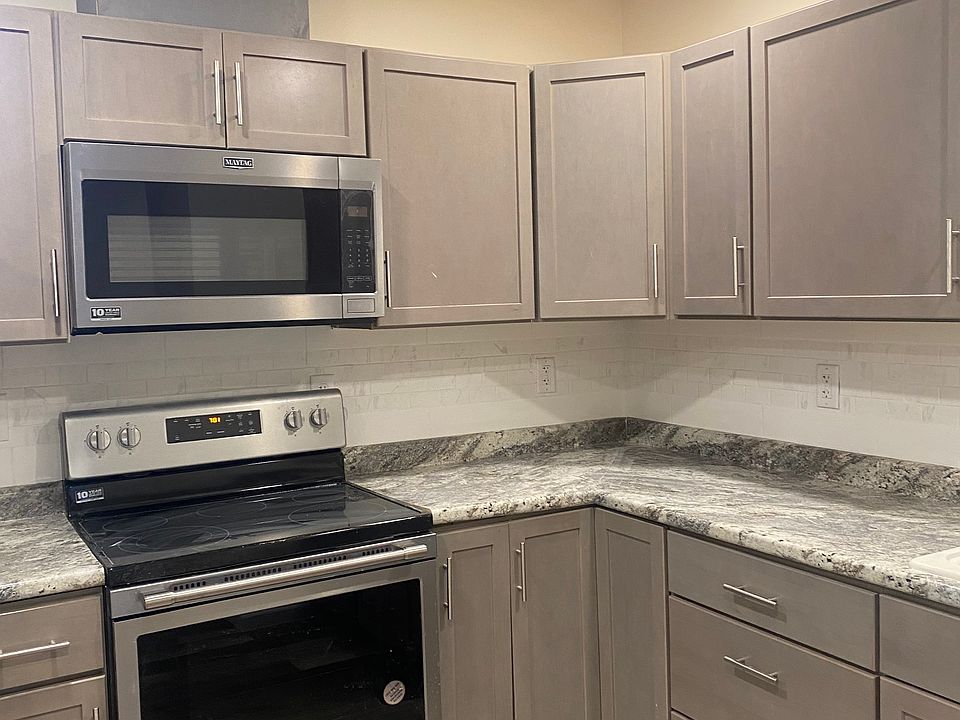 New Stainless Steel Appliances and custom tiled backsplash.