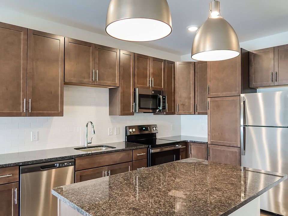 Large Chef-Ready Kitchens with Dark Cabinets, Pantries, and Stainless Steel Appliances